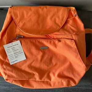 Baggallini orange small backpack purse